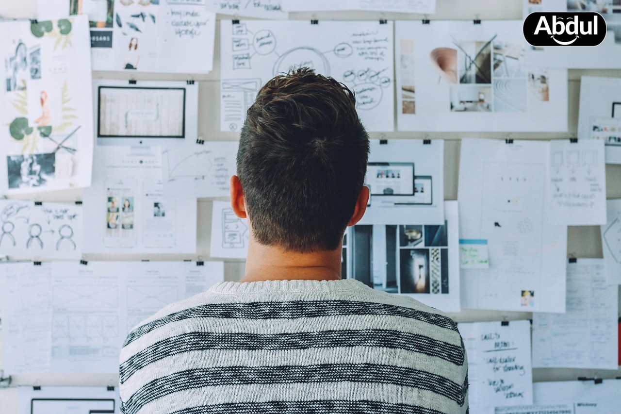 Person strategizing at whiteboard
