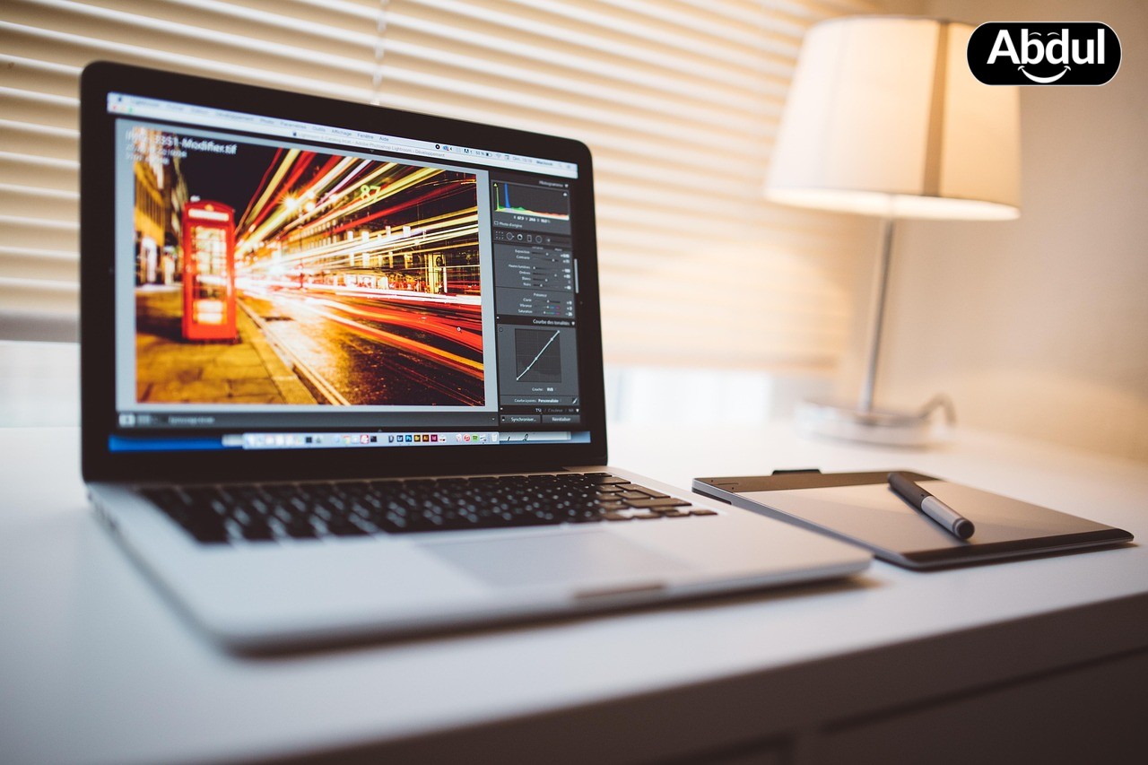 Small business owner editing video on laptop